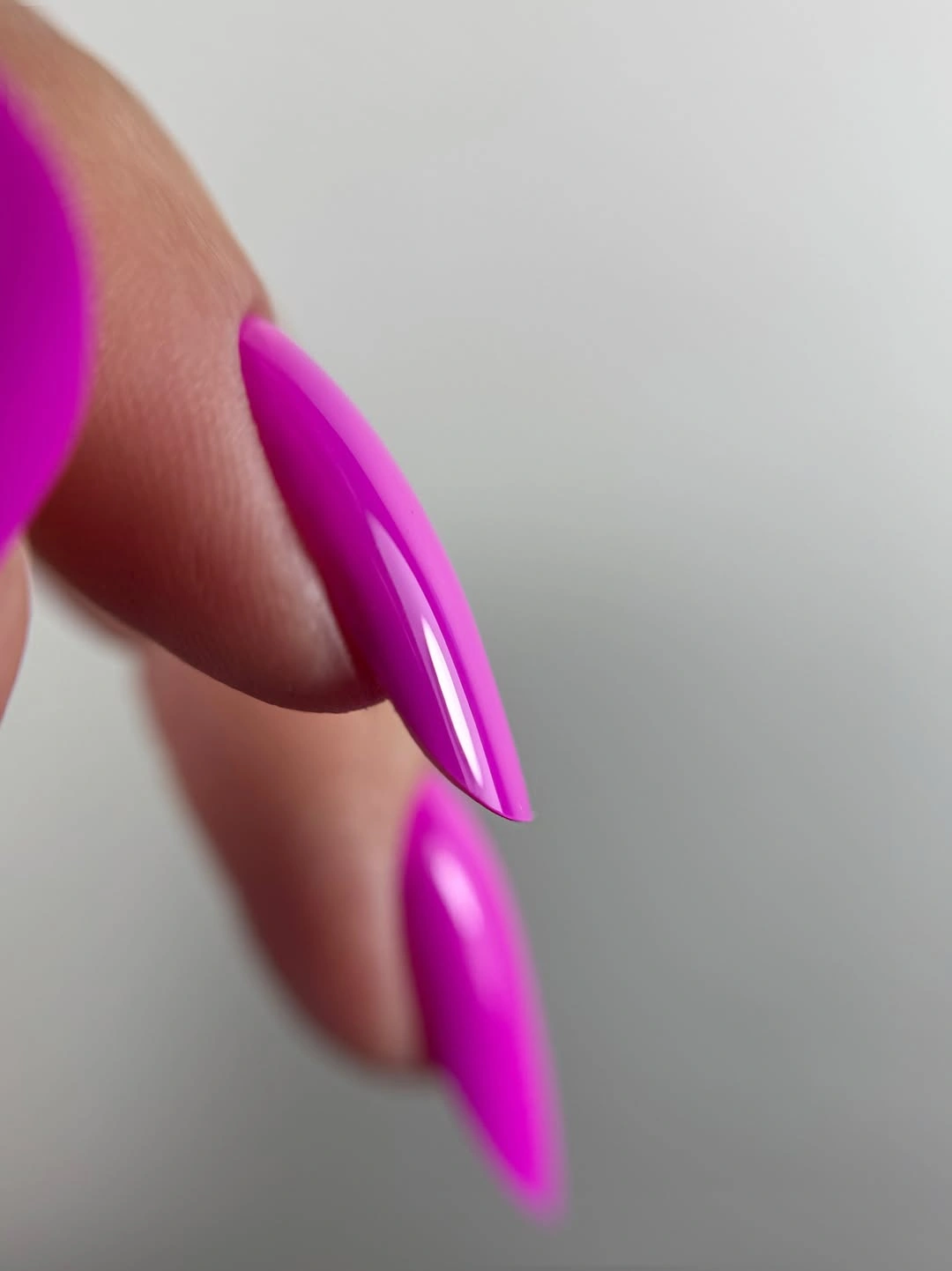 Long almond glossy vivid magenta nails