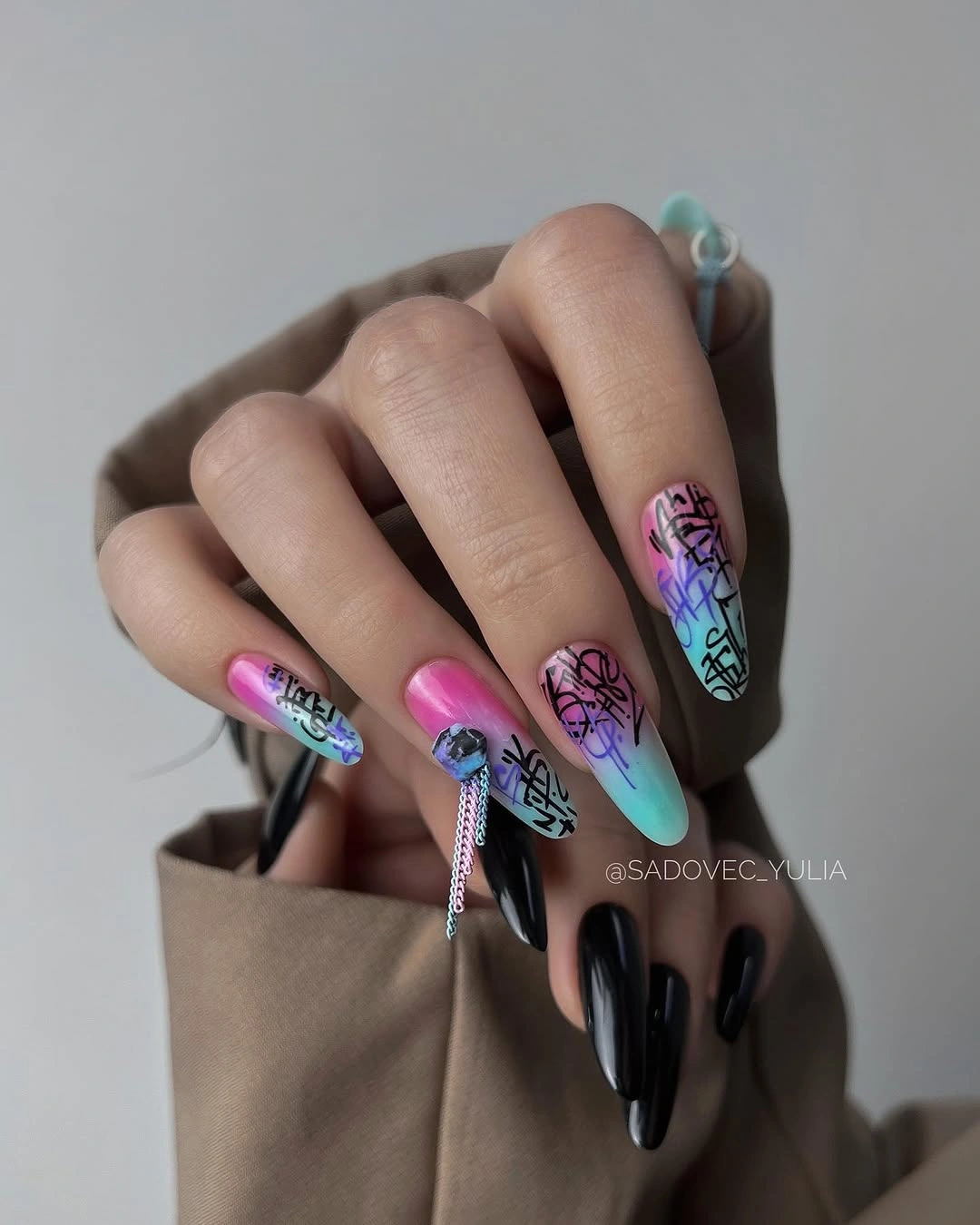 Long almond nails with black and vivid magenta blue teal panels