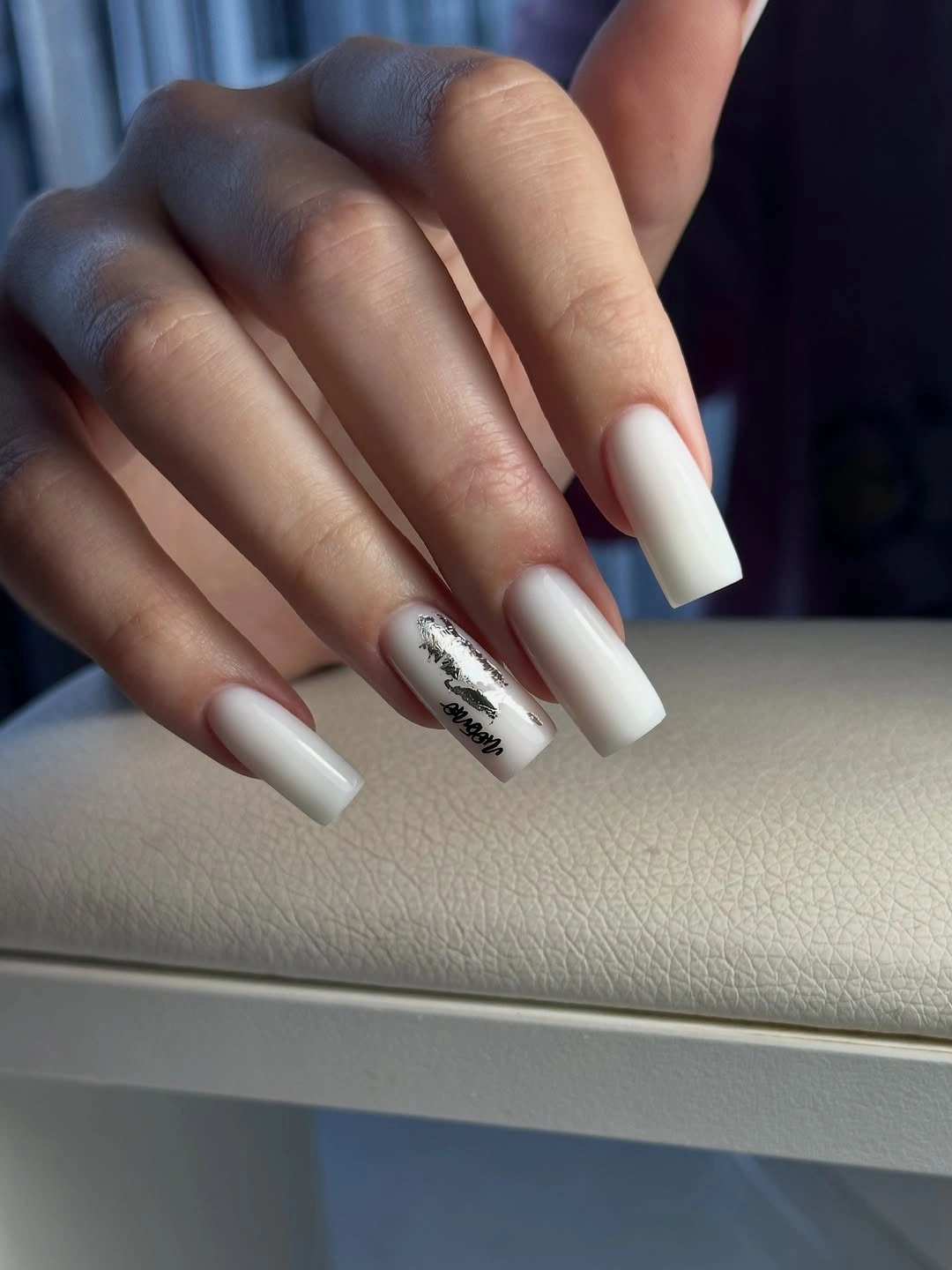Long white square nails with one silver black abstract accent