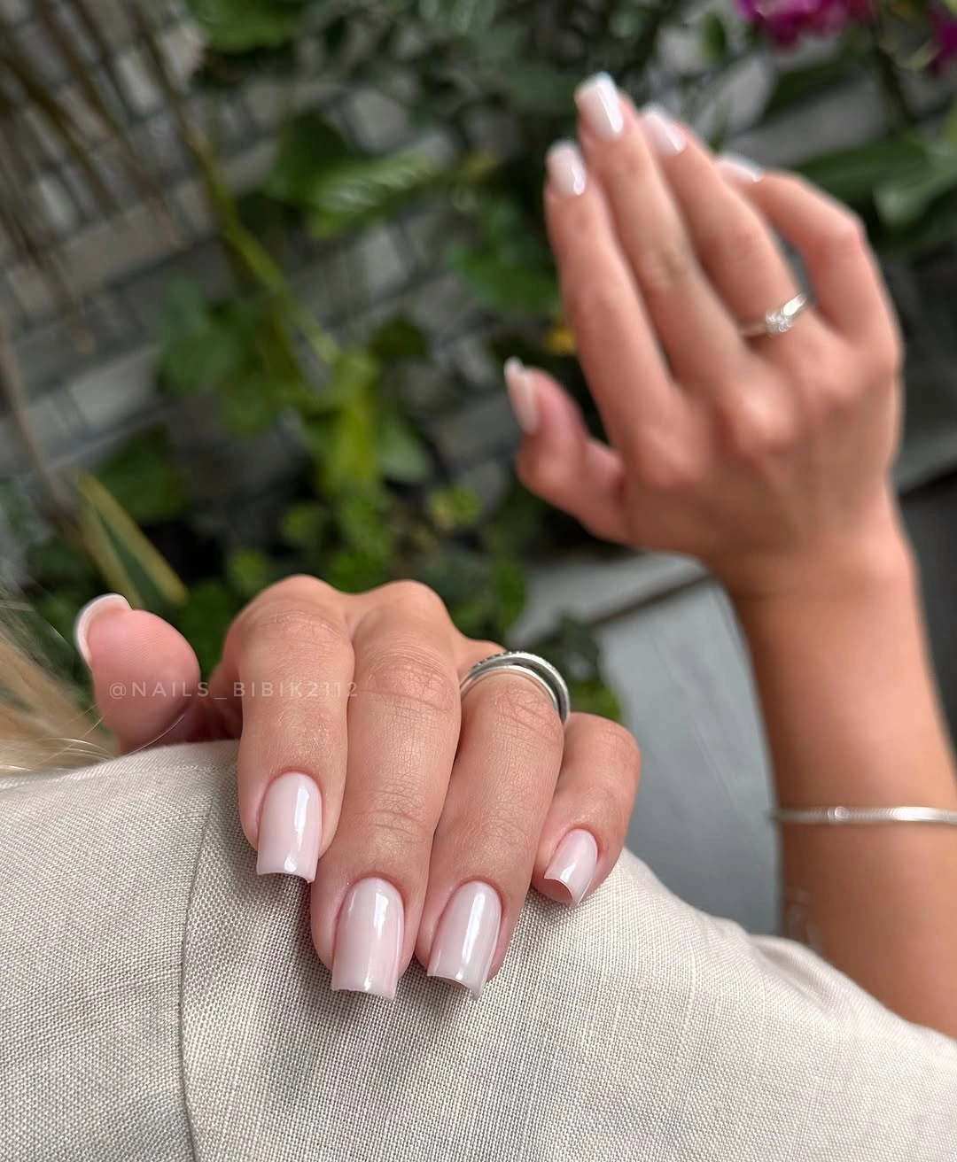 Short square pale pink nails with clean white tips