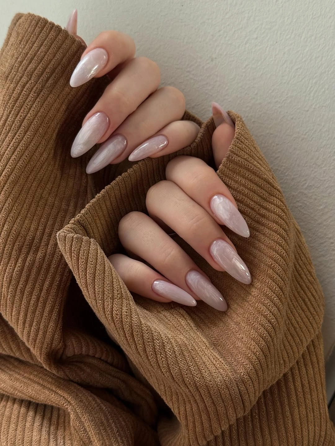 Long almond nails with translucent pearly blush finish