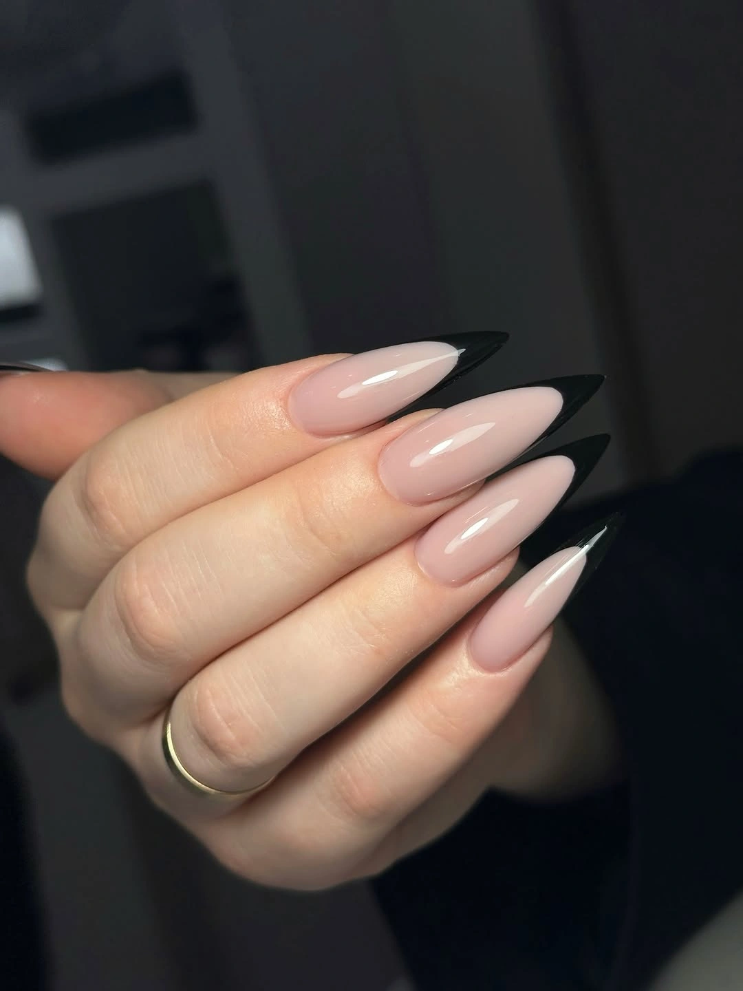 Long almond nails with narrow black French tips