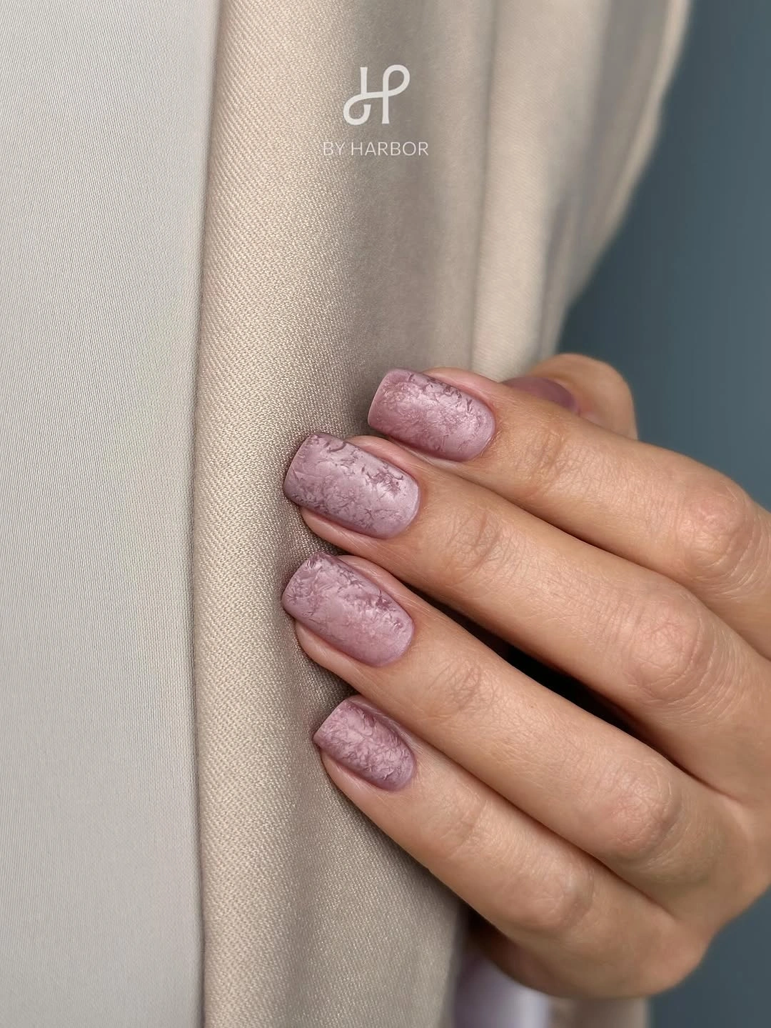 dusty mauve matte nails with subtle tonal botanical texture