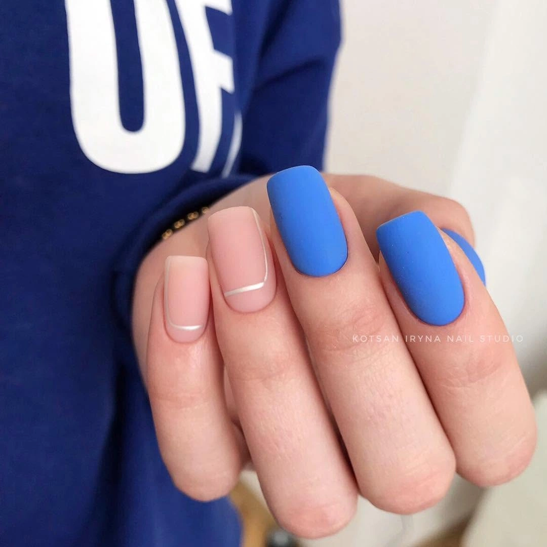 short rounded-square nails in playful pink blue green and orange blocks