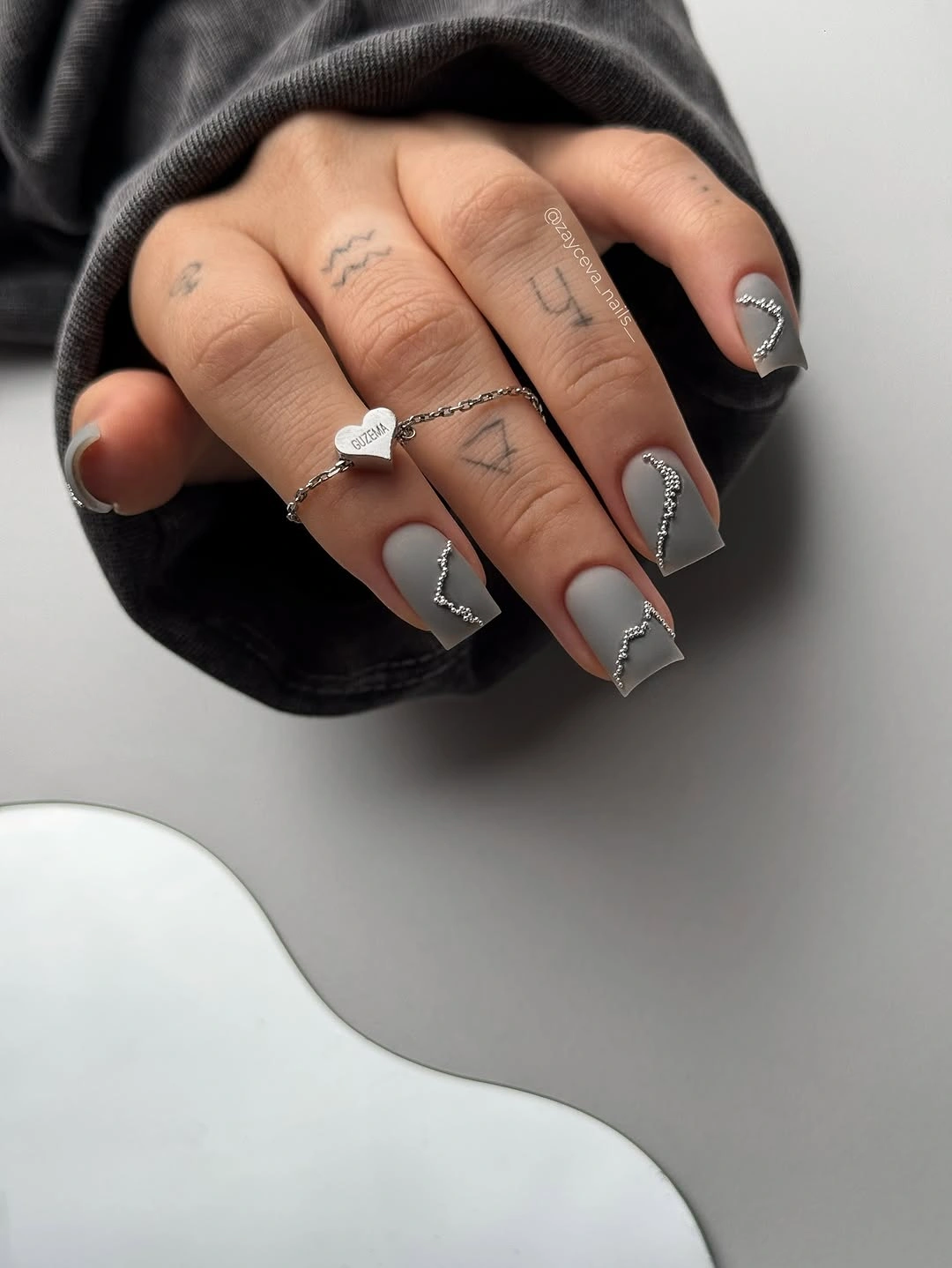 smoky gray-lilac square nails with thin silver wave accents