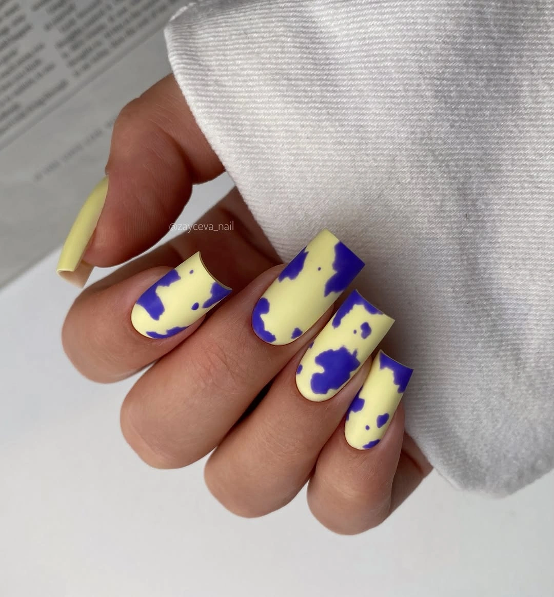 butter yellow square nails with bold cobalt abstract patches