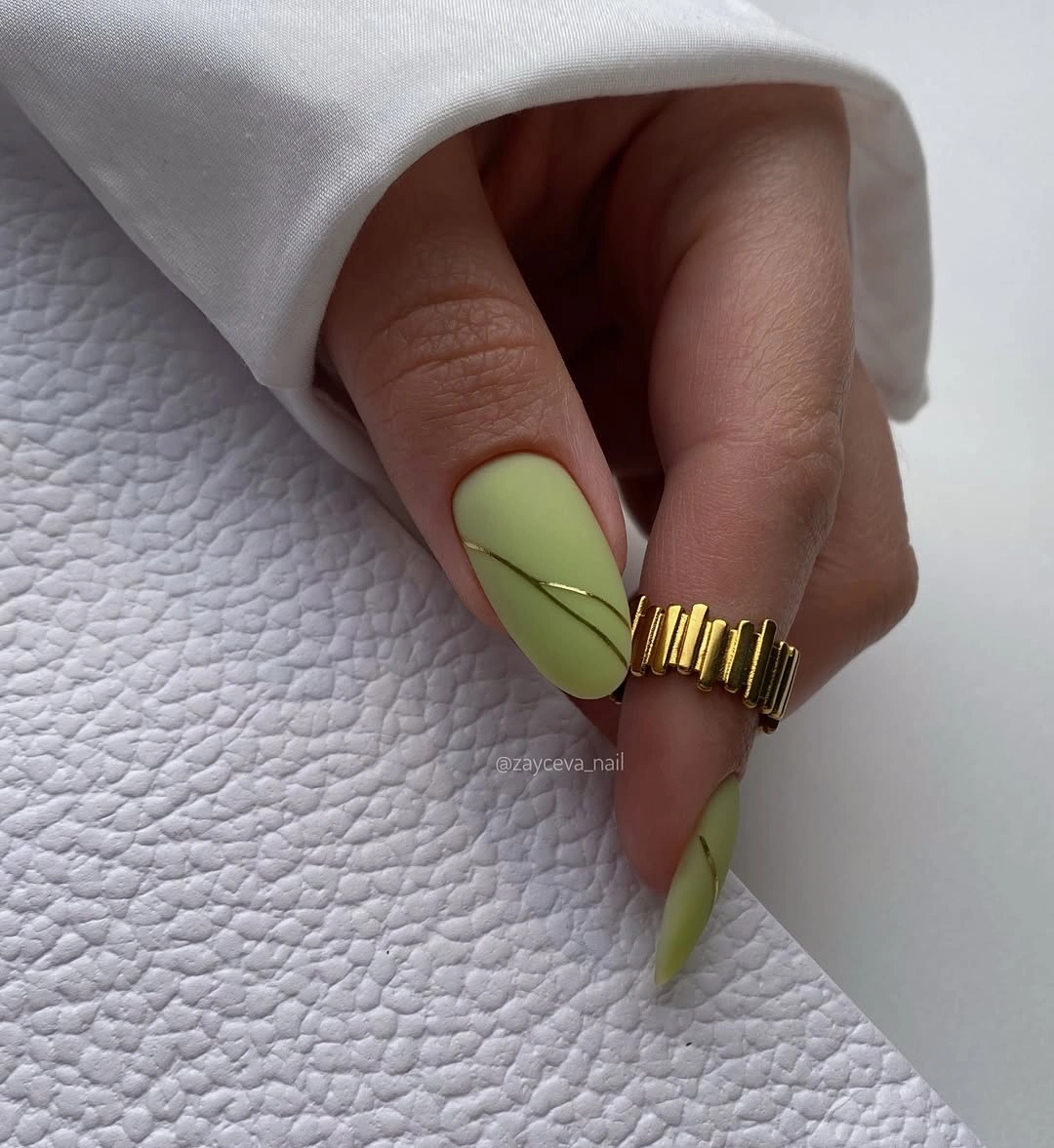 long almond nails in a vivid chartreuse green solid color