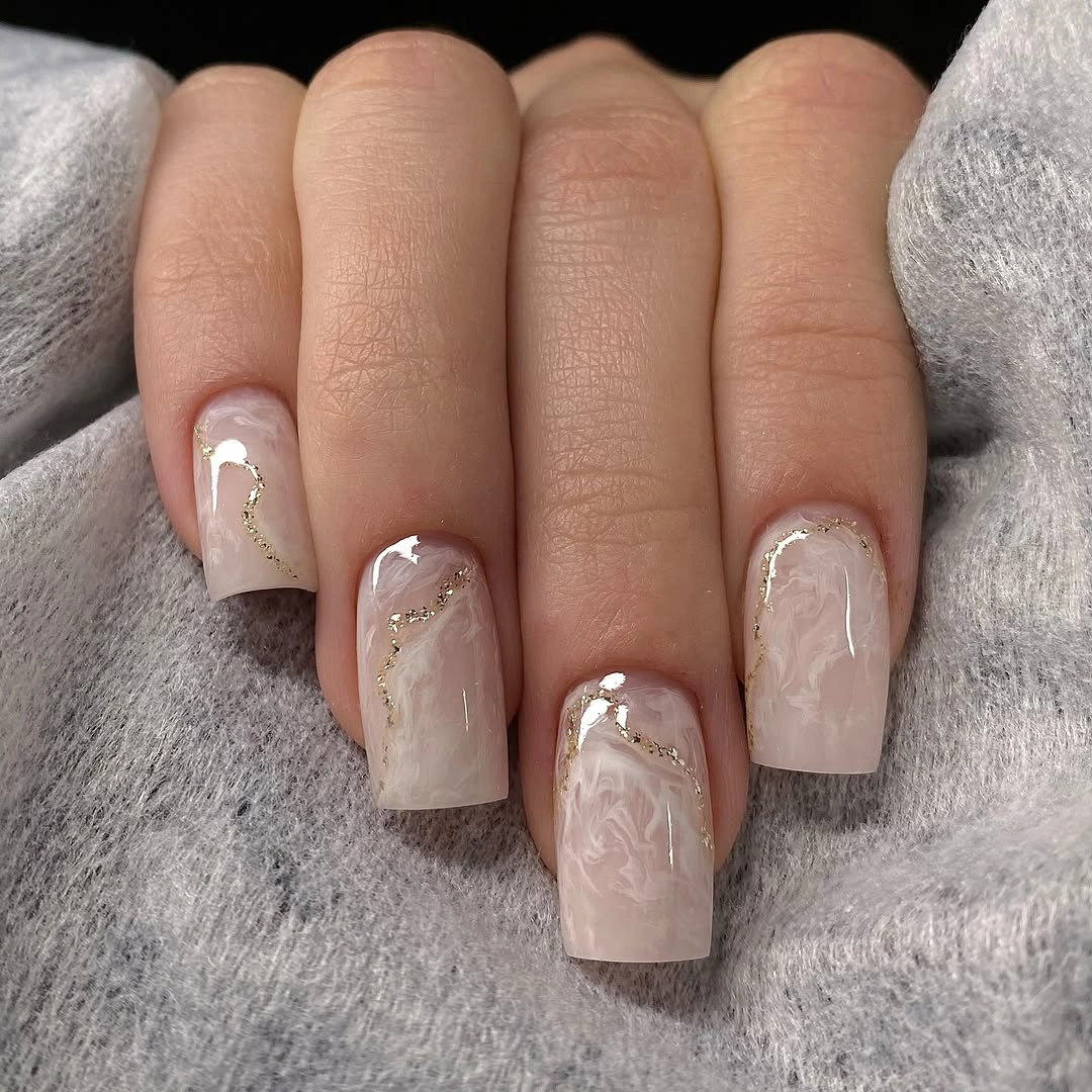 Medium square blush nails with white marble and slim gold lines