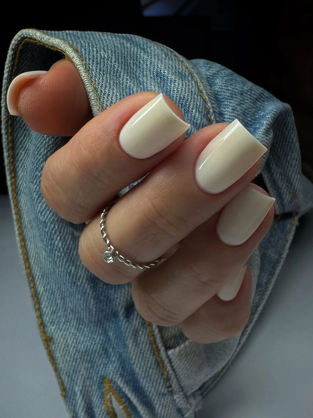 Medium square glossy ivory nails with a clean solid finish