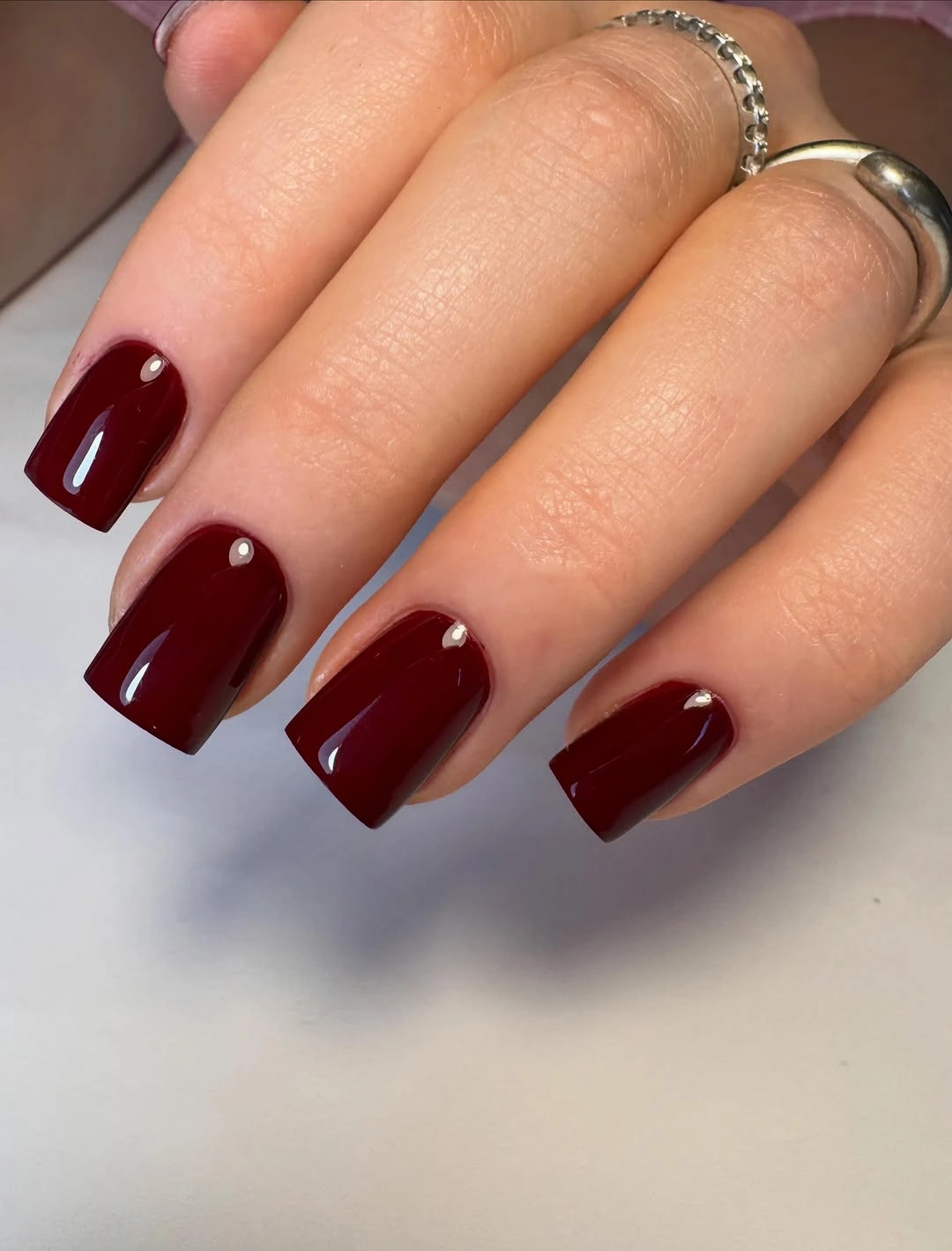 Short square nails in deep glossy cherry red