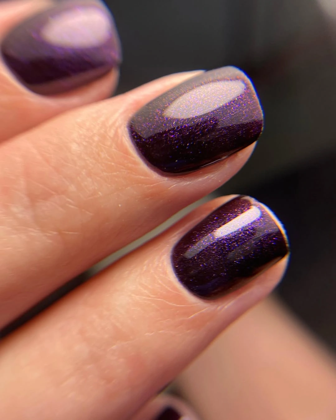 Short square nails in deep purple gloss with fine shimmer