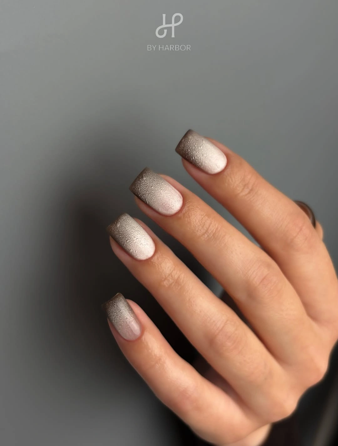 Short square nails with warm pearly beige shimmer