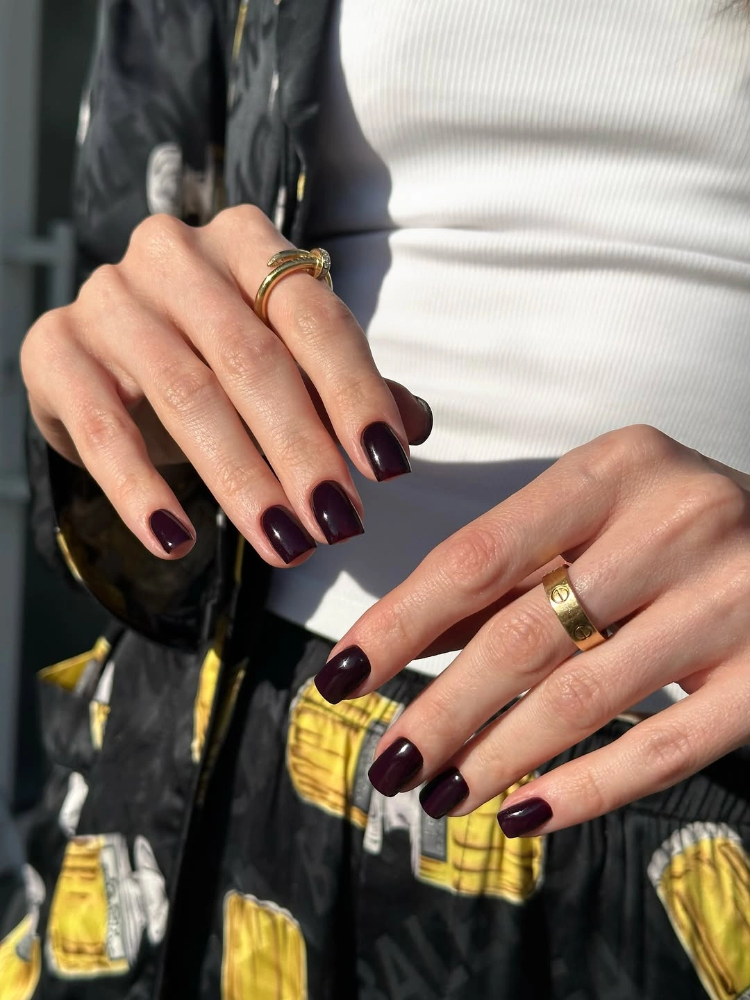 Short rounded square nails in glossy deep burgundy wine color
