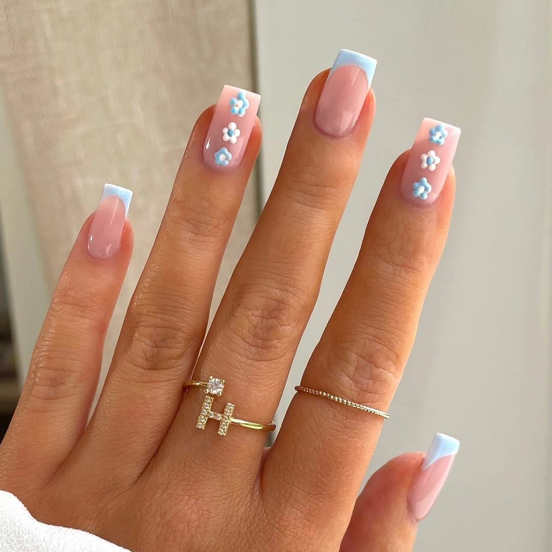 Pale blue French tips with tiny flower accents