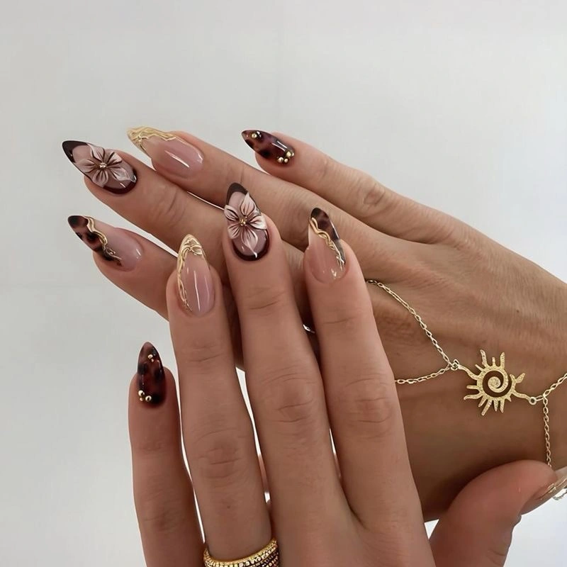 Tortoise French tips with soft floral nail accents