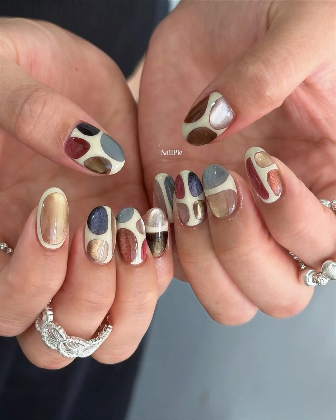 Short abstract nails with warm color block patches