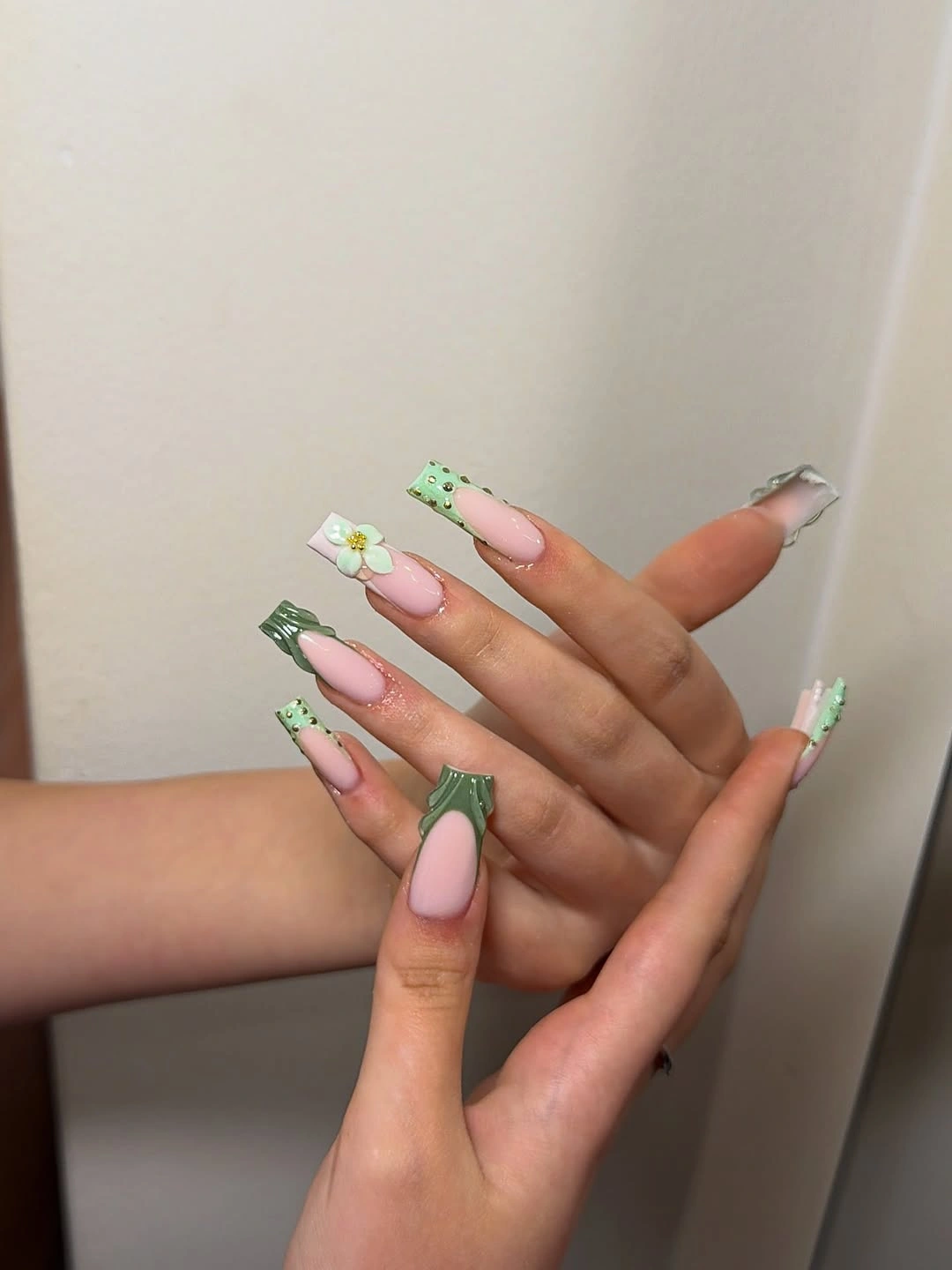Olive green French tips with flowers and studs