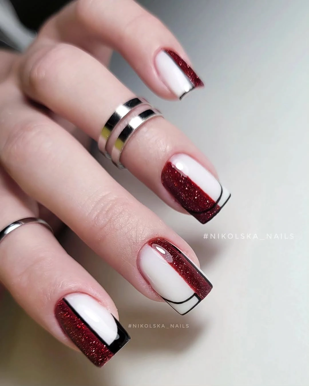 Red glitter block nails with thin black linework