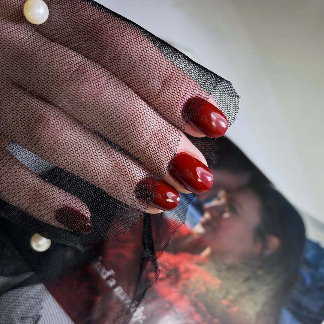 Short rounded square nails in deep glossy garnet red