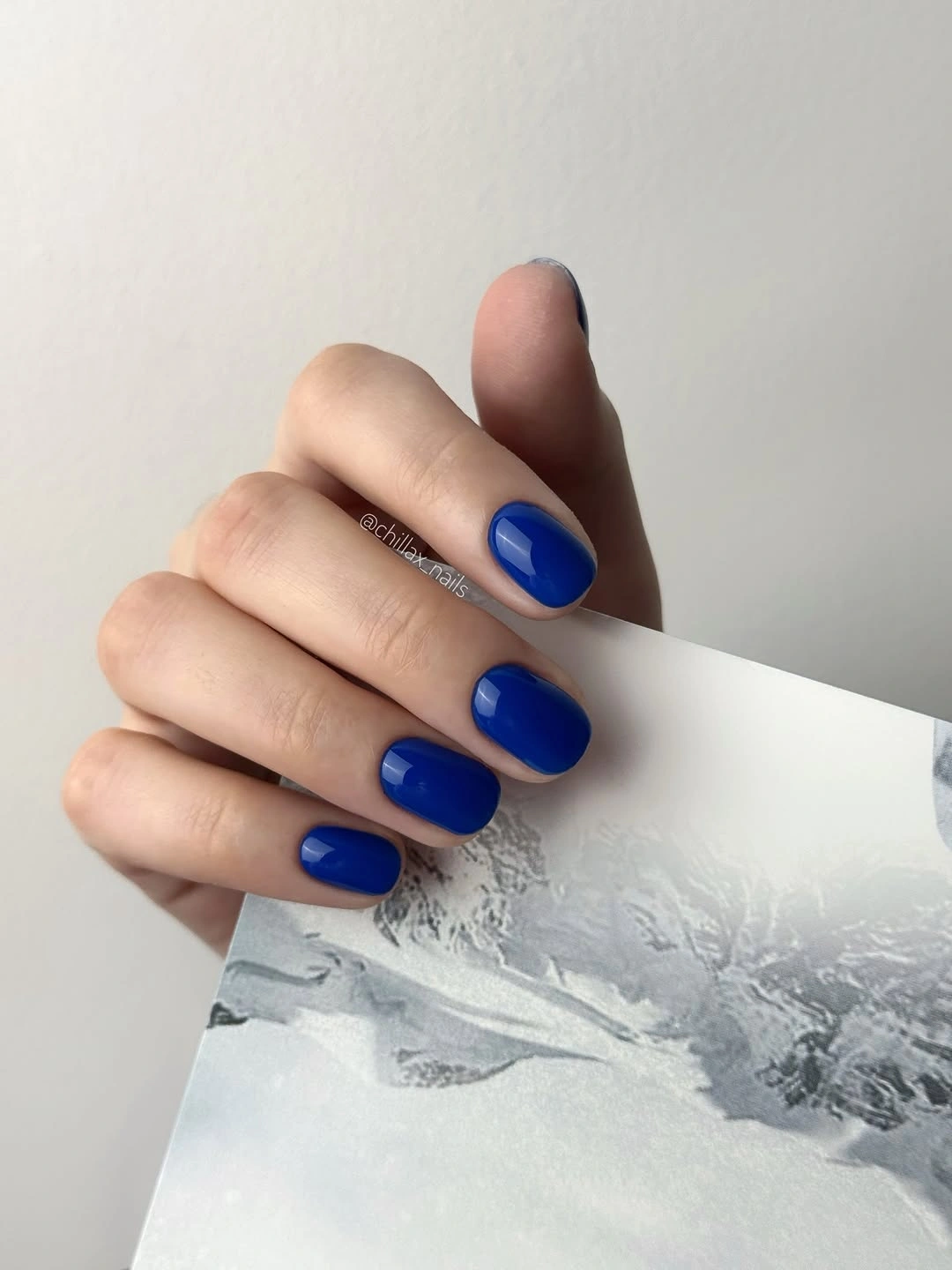 Short square nails in saturated glossy royal blue