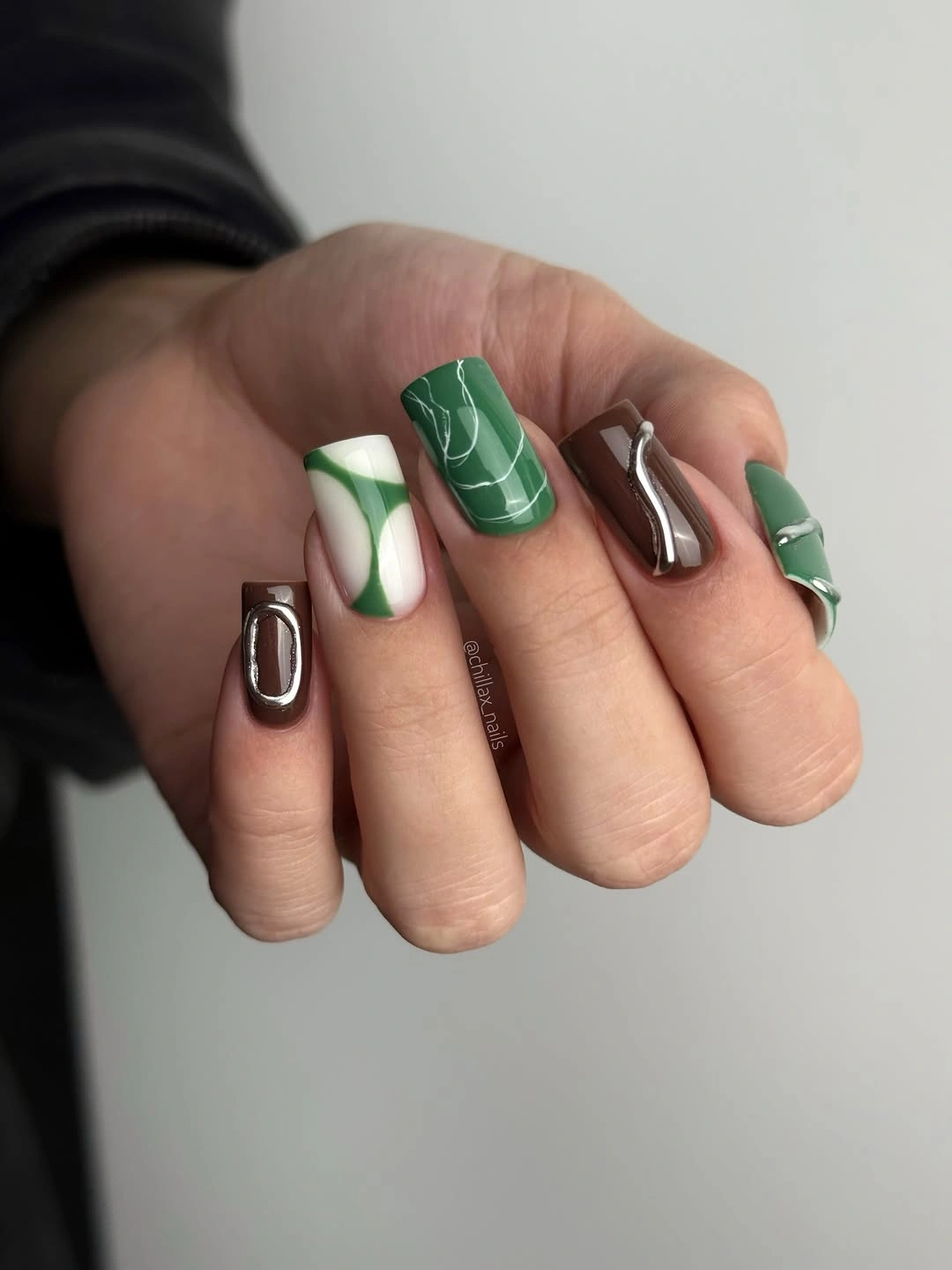 Short square nails with green white brown abstract details