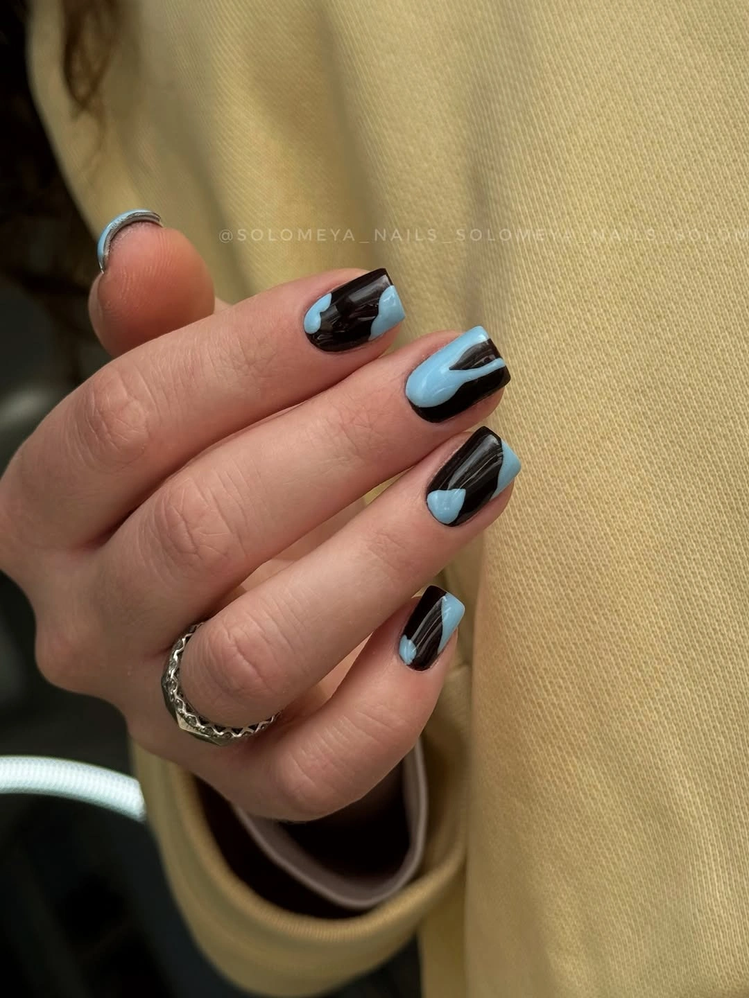 Medium almond nails with black pale blue and metallic split tips