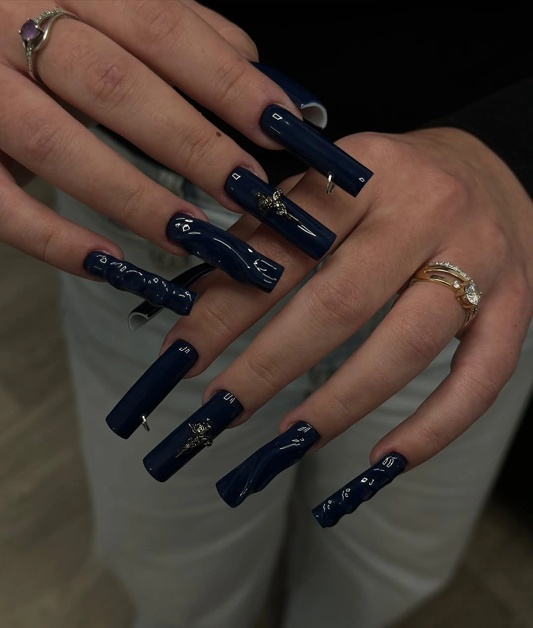 very long coffin square nails with navy blue graphic details
