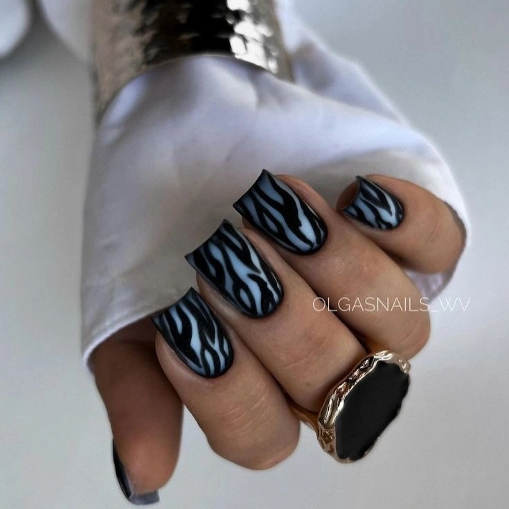 medium long square nails with black white and blue graphics
