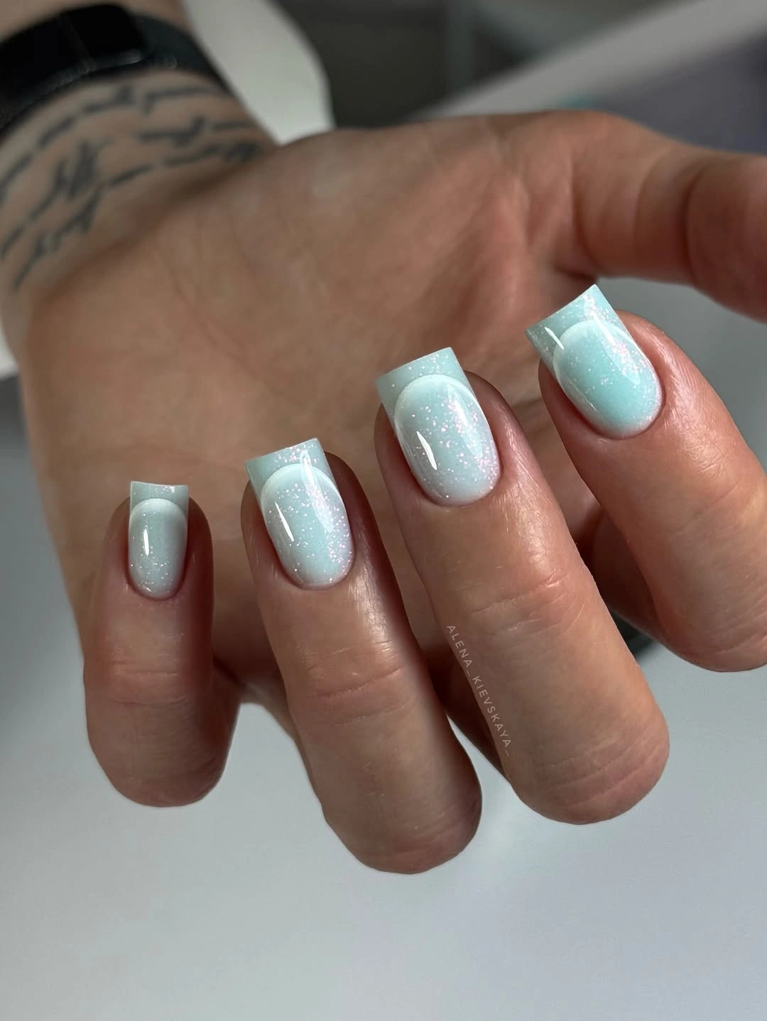 medium square nails in milky aqua white with soft shimmer