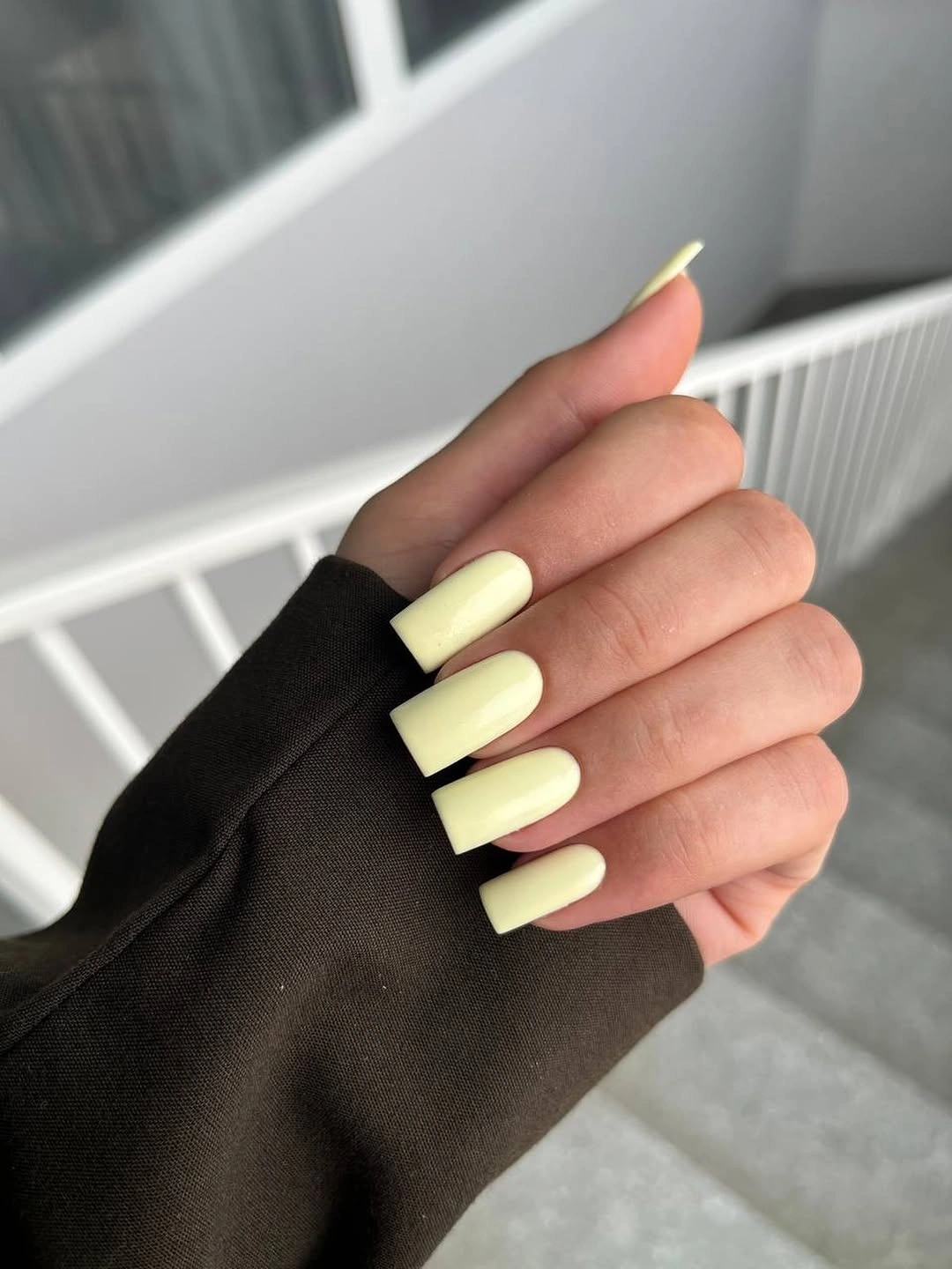 medium long square nails in glossy pale yellow