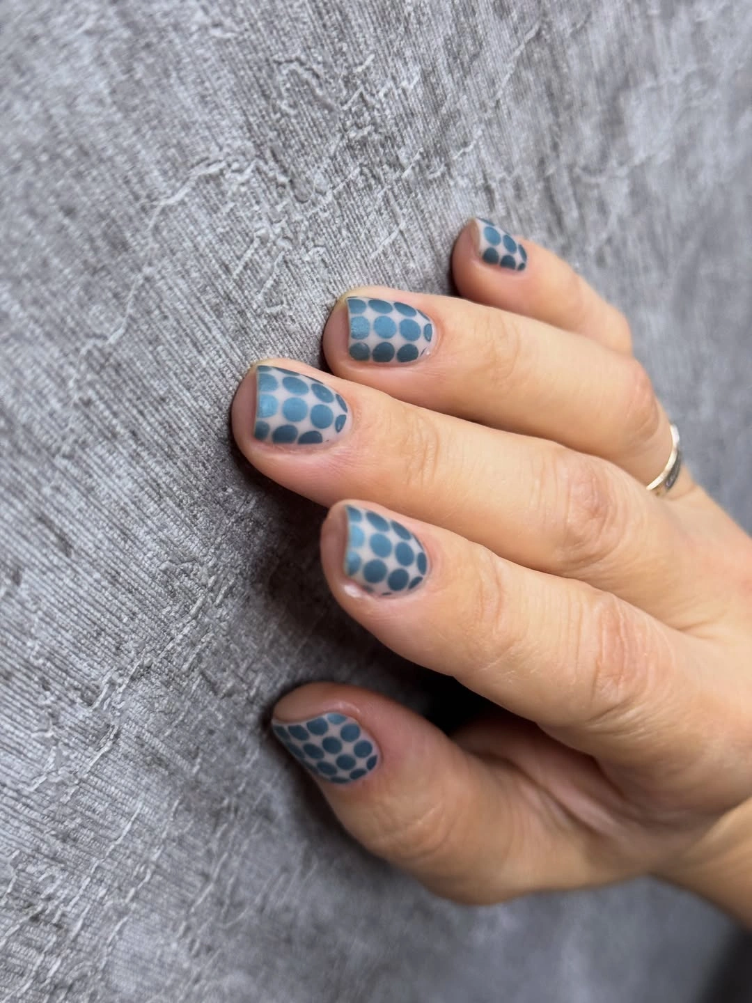 Short blue dotted nails on sheer base