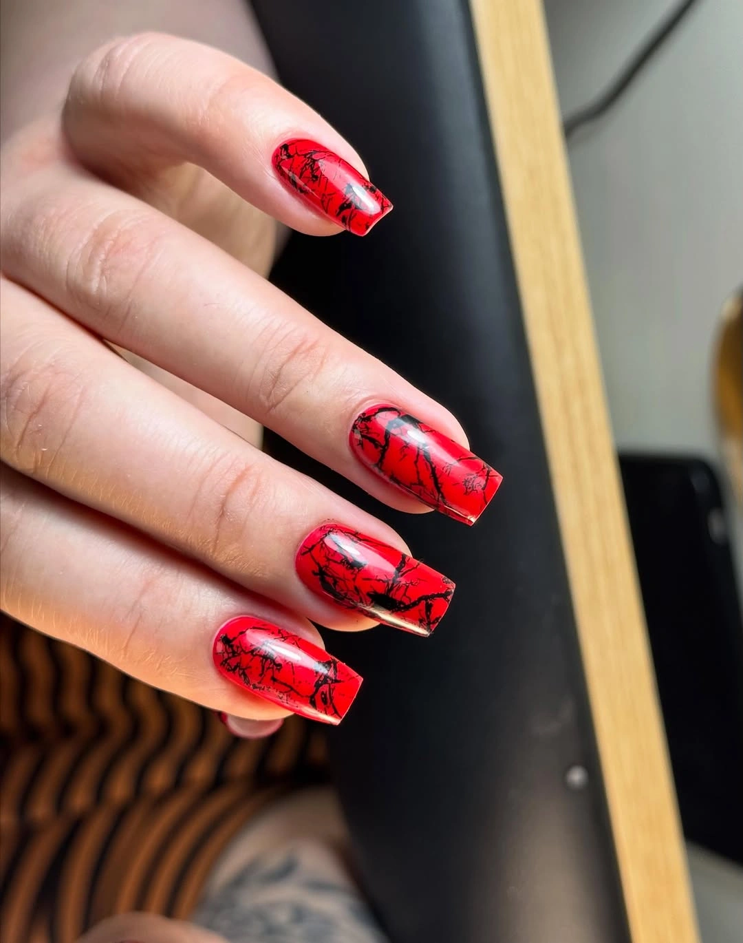 Red square nails with black crackle lines