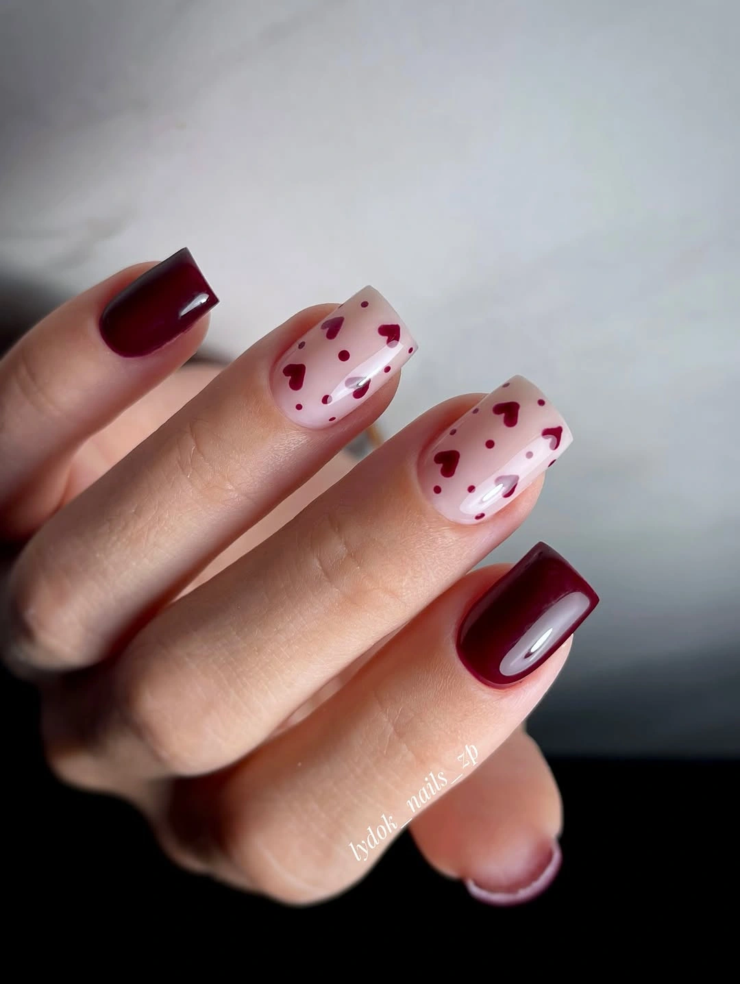Burgundy heart accent nails on soft pink