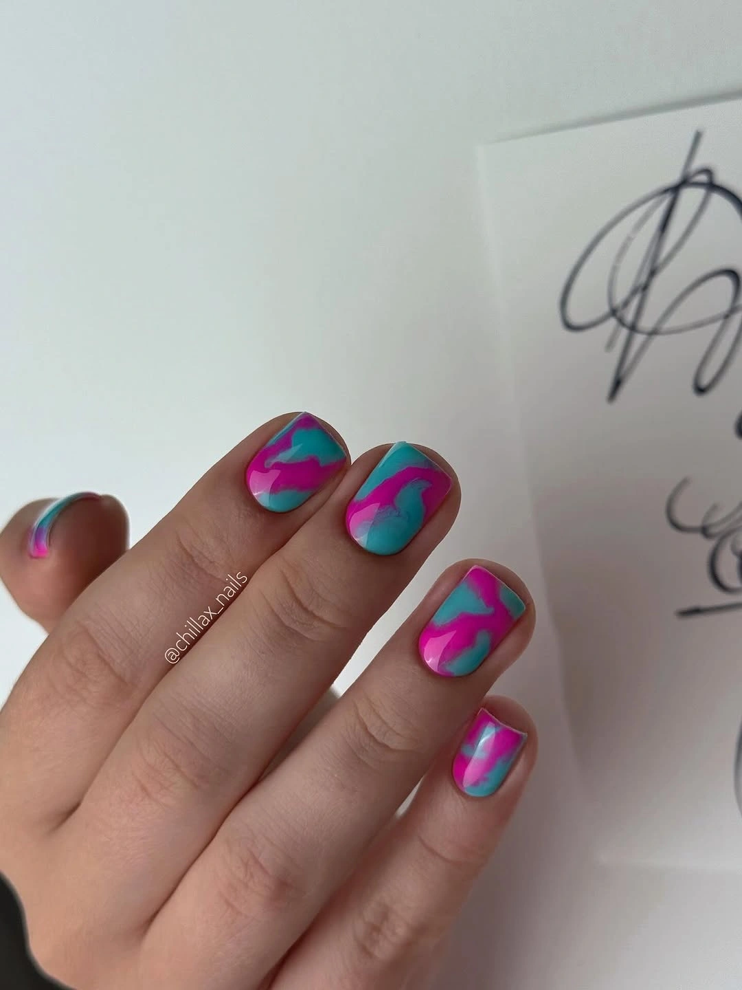 Short turquoise and pink marble nails