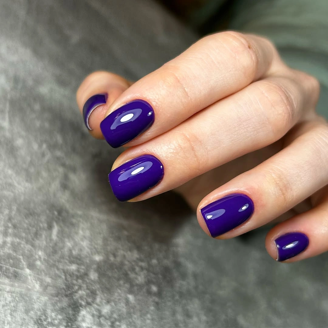Glossy violet short rounded nails