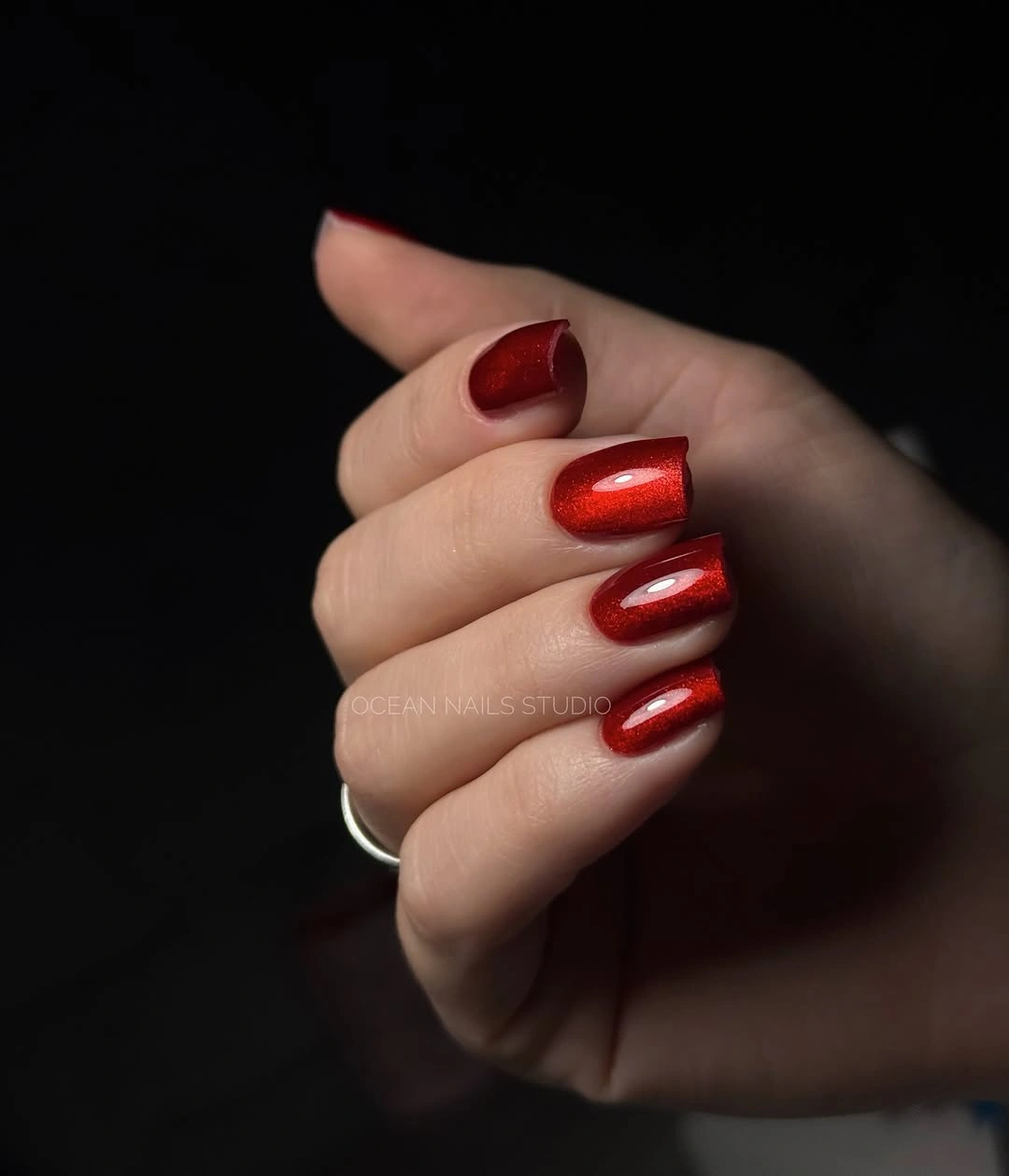 short almond nails with saturated glossy red color