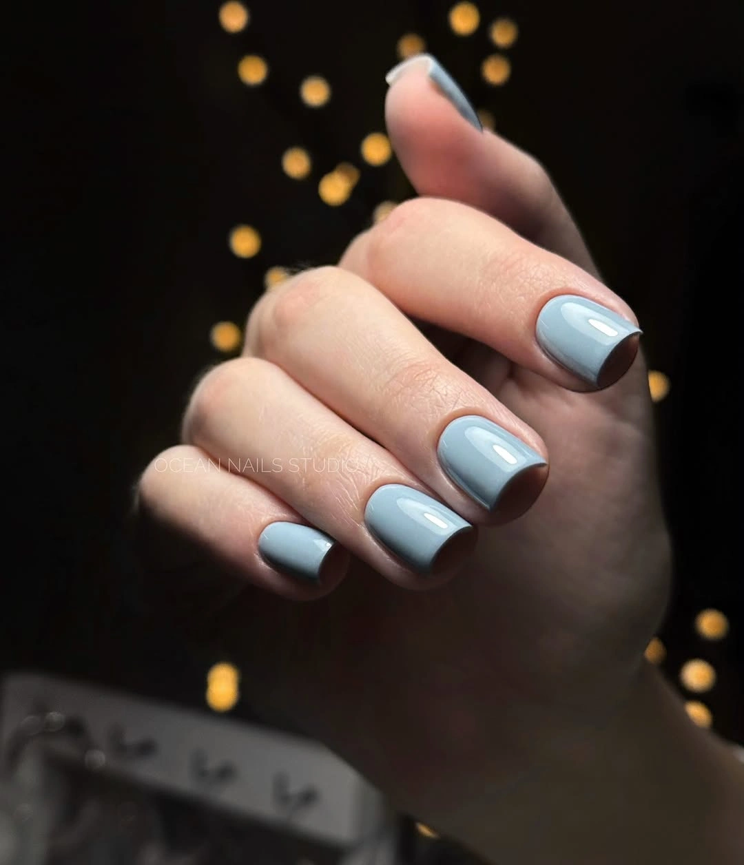short rounded square nails in glossy pale blue