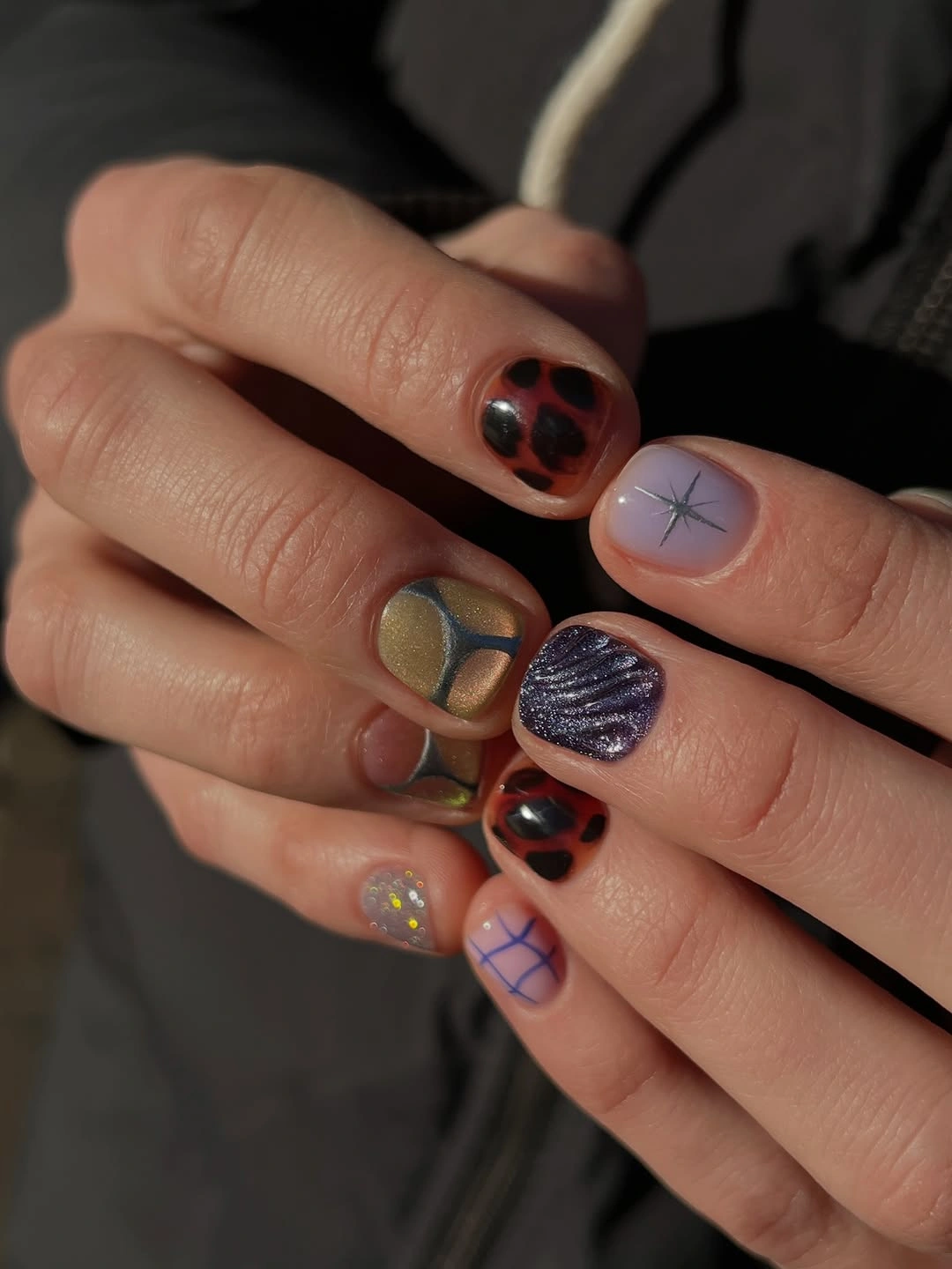medium nails mixing brown plum mauve and amber accents
