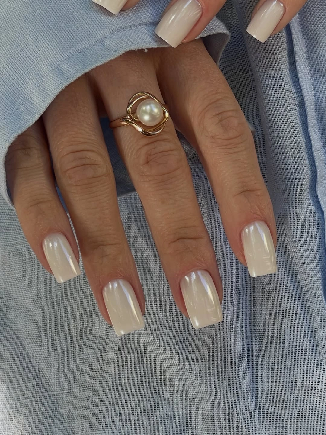 long square nails with a sheer milky ivory finish