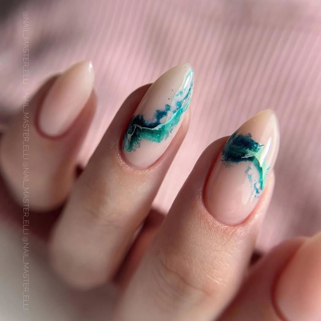 long almond nails with teal and blue abstract strokes