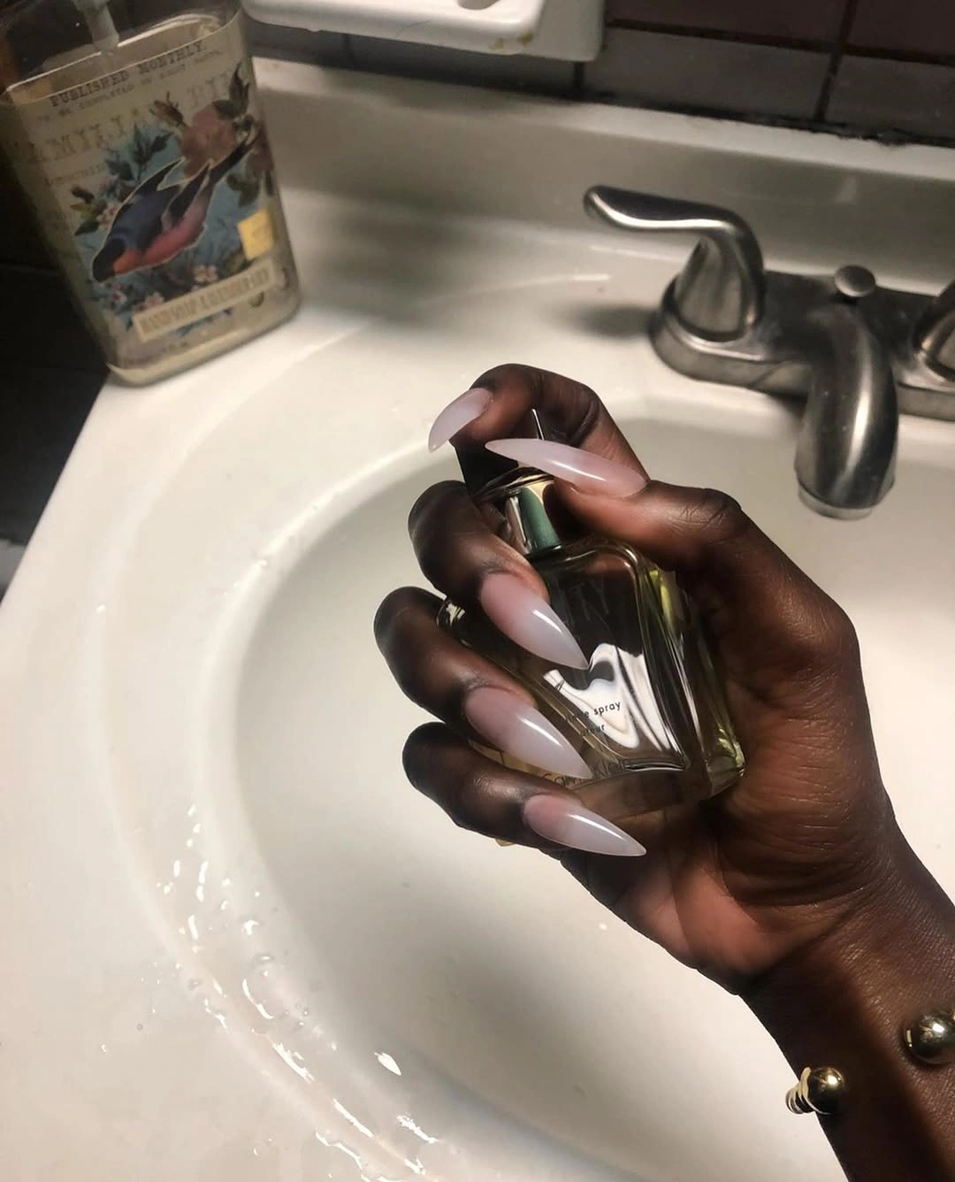 Pale pink almond nails with smoky dark tips