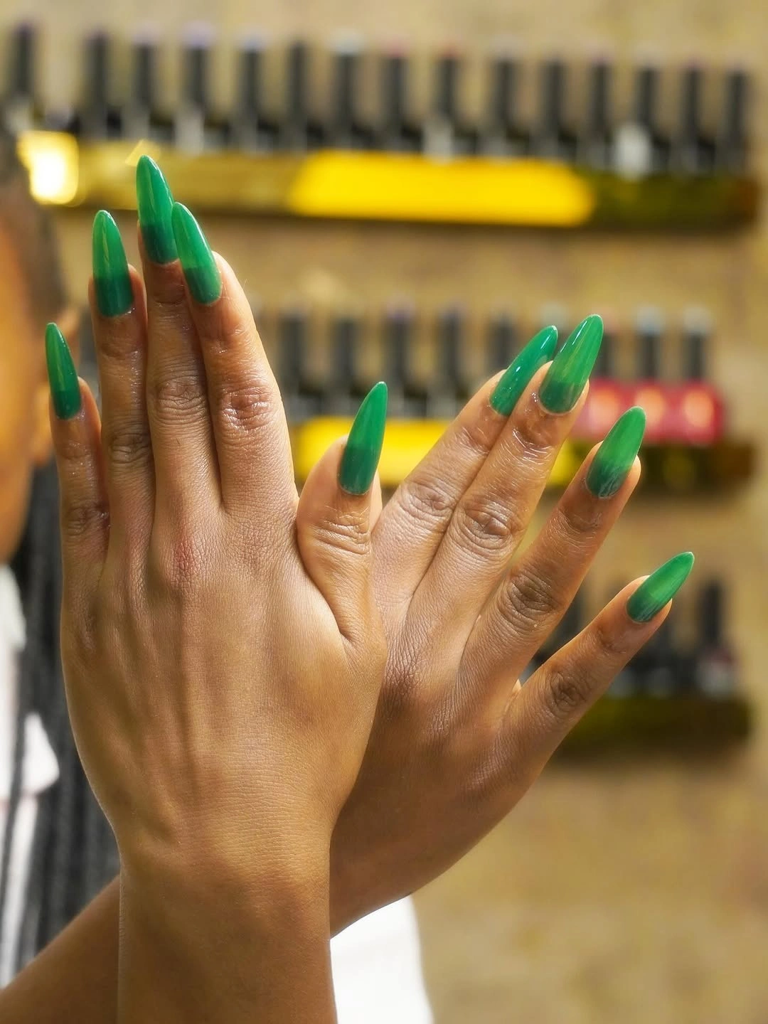 Long vivid green stiletto nails in coordinated tones