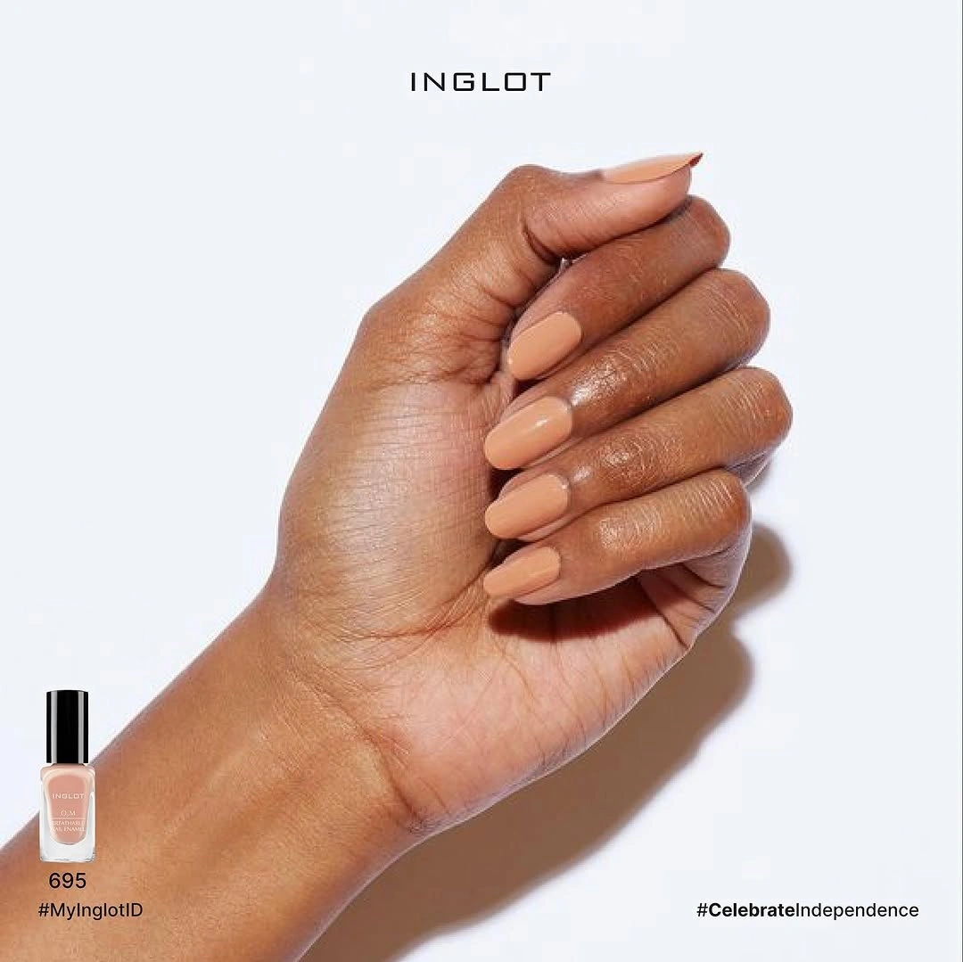 Minimal nude almond nails on a clean pale background