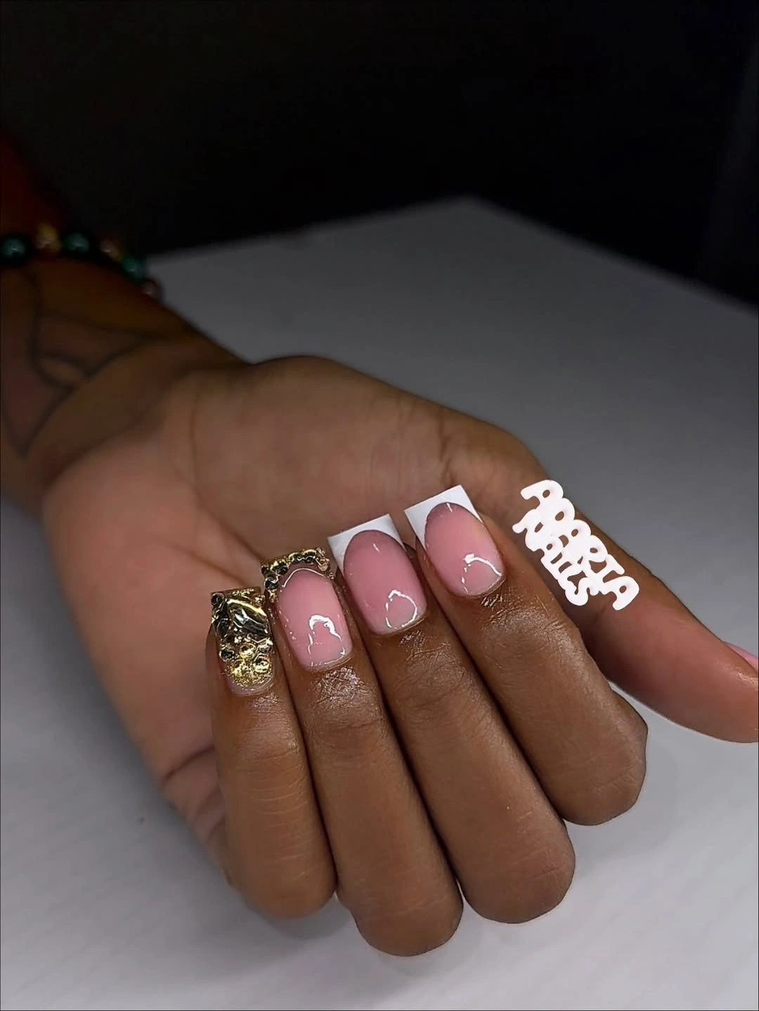 Short pale pink nails with mixed metallic accents