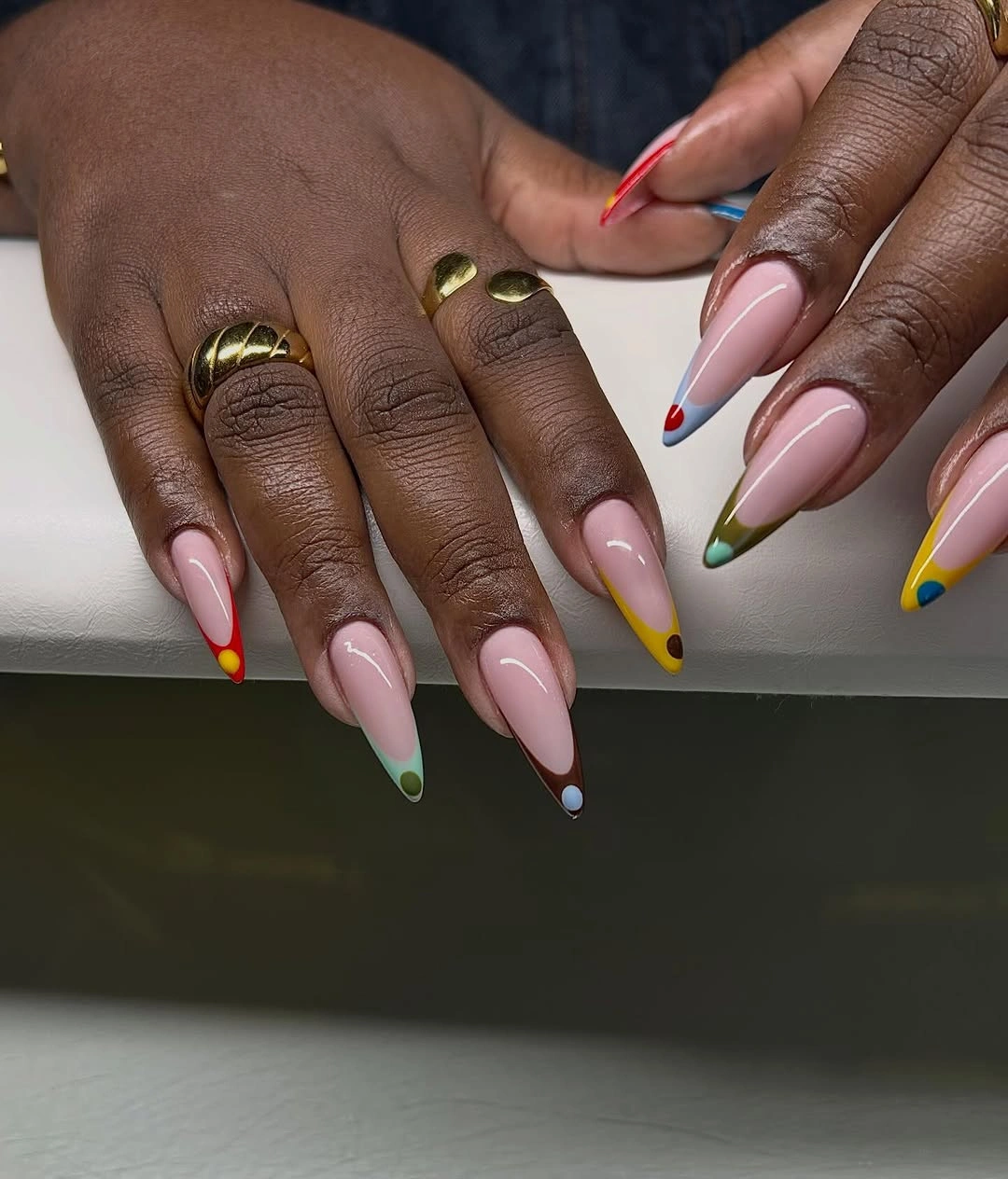 Long almond pink nails with bright multicolor French tips