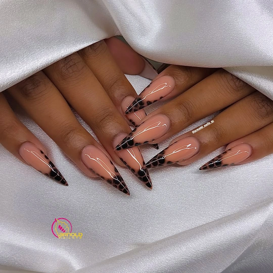 Long almond nude nails with black white graphic French tips