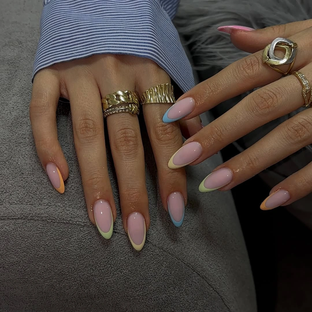 Pink almond nails with mismatched pastel French tips