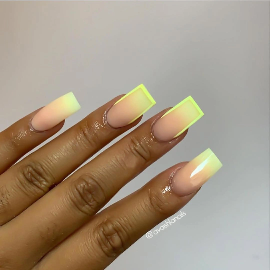 Long nude square nails with neon green outlines