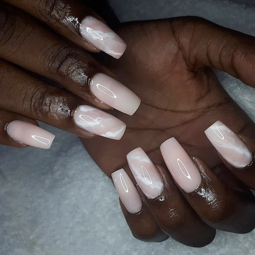Pale square nails with soft white marble accents