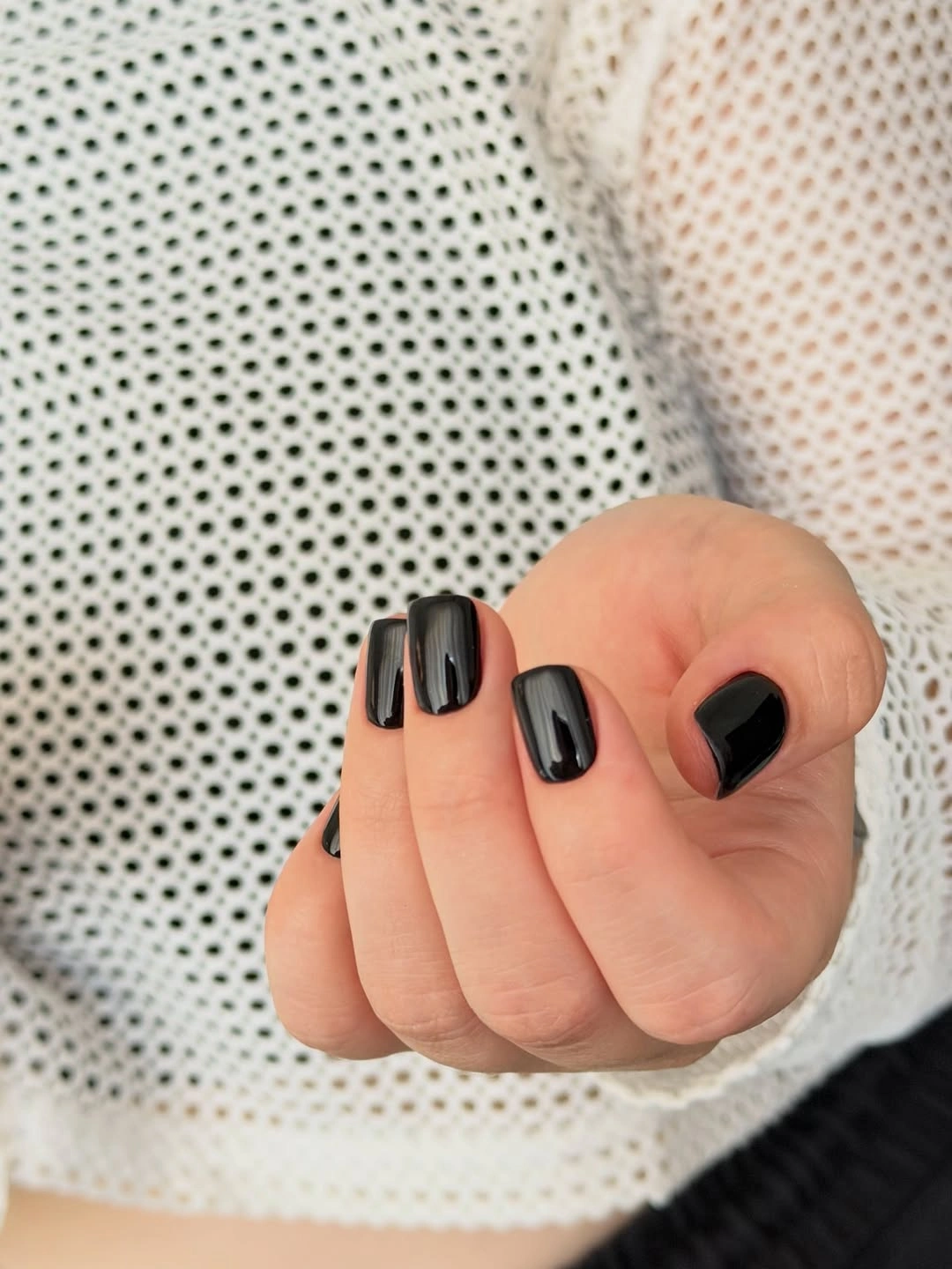 short rounded-square nails in a simple glossy deep black